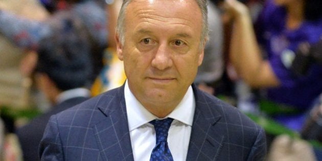 Japan national football team coach Alberto Zaccheroni arrives at Narita Airport on June 27, 2014. Japan's World Cup squad returned home after a winless campaign in Brazil. AFP PHOTO / KAZUHIRO NOGI (Photo credit should read KAZUHIRO NOGI/AFP/Getty Images)