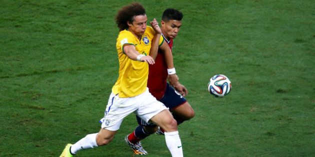 FORTALEZA, BRAZIL - JULY 04: David Luiz of Brazil and Teofilo Gutierrez of Colombia compete for the ball during the 2014 FIFA World Cup Brazil Quarter Final match between Brazil and Colombia at Castelao on July 4, 2014 in Fortaleza, Brazil. (Photo by Michael Steele/Getty Images)