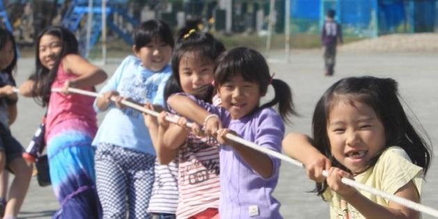 ISHINOMAKI, JAPAN - OCTOBER 23: (JAPANESE NEWSPAPERS OUT) Children play at elementary school on October 23, 2011 in Ishinomaki, Miyagi, Japan. The event takes place regularly for children who lost place to play in the quake. (Photo by Sankei/Sankei via Getty Images)