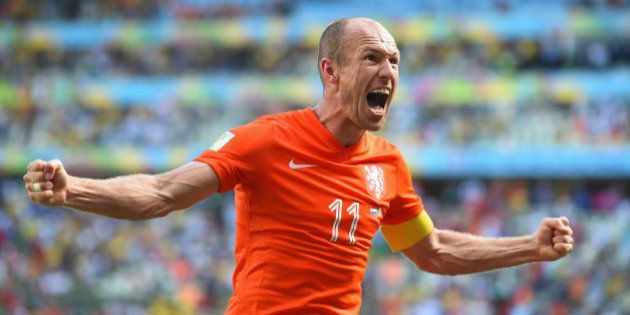 FORTALEZA, BRAZIL - JUNE 29: Arjen Robben of the Netherlands celebrates after defeating Mexico 2-1 during the 2014 FIFA World Cup Brazil Round of 16 match between Netherlands and Mexico at Castelao on June 29, 2014 in Fortaleza, Brazil. (Photo by Laurence Griffiths/Getty Images)