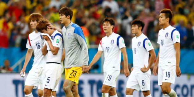 SAO PAULO, BRAZIL - JUNE 26: South Korea players look dejected after a 0-1 defeat to Belgium in the 2014 FIFA World Cup Brazil Group H match between South Korea and Belgium at Arena de Sao Paulo on June 26, 2014 in Sao Paulo, Brazil. (Photo by Phil Walter/Getty Images)