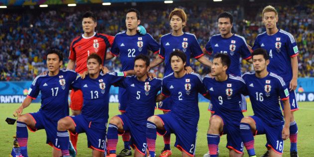 NATAL, BRAZIL - JUNE 19: Japan pose for a team photo during the 2014 FIFA World Cup Brazil Group C match between Japan and Greece at Estadio das Dunas on June 19, 2014 in Natal, Brazil. (Photo by Jamie McDonald/Getty Images)