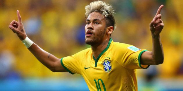 BRASILIA, BRAZIL - JUNE 23: Neymar of Brazil celebrates scoring his team's second goal and his second of the game during the 2014 FIFA World Cup Brazil Group A match between Cameroon and Brazil at Estadio Nacional on June 23, 2014 in Brasilia, Brazil. (Photo by Clive Brunskill/Getty Images)