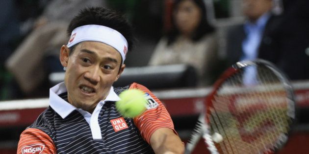 TOKYO, JAPAN - OCTOBER 05: Kei Nishikori of Japan in action during the men's singles final match against Milos Raonic of Canada on day seven of Rakuten Open 2014 at Ariake Colosseum on October 5, 2014 in Tokyo, Japan. (Photo by Atsushi Tomura/Getty Images)