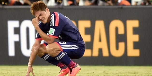 Japan's forward Yoshito Okubo gestures following a 0-0 score during a Group C match between Japan and Greece at the Dunas Arena in Natal during the 2014 FIFA World Cup on June 19, 2014. AFP PHOTO / ARIS MESSINIS (Photo credit should read ARIS MESSINIS/AFP/Getty Images)