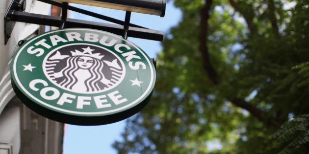 LONDON, ENGLAND - OCTOBER 16: The signage on a branch of Starbucks Coffee on October 16, 2012 in London, England. It has been reveled that Starbucks, the world's second largest coffee chain, has paid no tax in the UK for the past three years despite sales exceeding 1 billion GBP. Since first trading in the UK in 1998 Starbucks has paid 8.6 million GBP in income tax with total sales of over 3 billion GBP in the same period. (Photo by Oli Scarff/Getty Images)