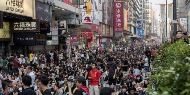 Pro-democracy protesters block off a major road in the Kowloon district of Hong Kong on September 29, 2014. Hong Kong has been plunged into the worst political crisis since its 1997 handover as pro-democracy activists take over the streets following China's refusal to grant citizens full universal suffrage. AFP PHOTO / ALEX OGLE (Photo credit should read Alex Ogle/AFP/Getty Images)