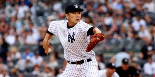 NEW YORK, NY - SEPTEMBER 21: Masahiro Tanaka #19 of the New York Yankees pitches in the first inning against the Toronto Blue Jays during the game at Yankee Stadium on September 21, 2014 in the Bronx borough of New York City. (Photo by A Marlin/Getty Images)