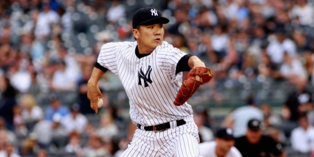 NEW YORK, NY - SEPTEMBER 21: Masahiro Tanaka #19 of the New York Yankees pitches in the first inning against the Toronto Blue Jays during the game at Yankee Stadium on September 21, 2014 in the Bronx borough of New York City. (Photo by A Marlin/Getty Images)