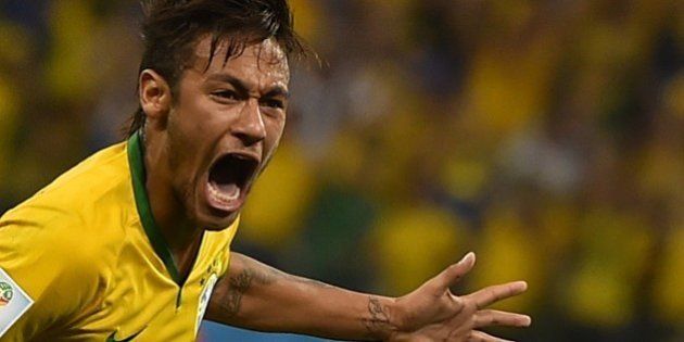Brazil's forward Neymar celebrates scoring during a Group A football match between Brazil and Croatia at the Corinthians Arena in Sao Paulo during the 2014 FIFA World Cup on June 12, 2014. AFP PHOTO / FABRICE COFFRINI (Photo credit should read FABRICE COFFRINI/AFP/Getty Images)