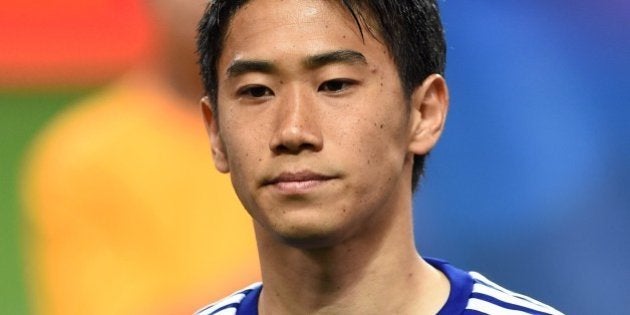 Japan national football team forward Shinji Kagawa poses prior to their internatiional friendly match against Cyprus in Saitama on May 27, 2014. AFP PHOTO / TOSHIFUMI KITAMURA (Photo credit should read TOSHIFUMI KITAMURA/AFP/Getty Images)