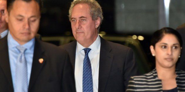 US Trade Representative Michael Froman (C) arrives to hold talks on the deadlocked Trans-Pacific Partnership (TPP) with his Japanese counterpart at the cabinet office in Tokyo on April 19, 2015. The Trans-Pacific Partnership is a trade framework negotiated between Australia, Brunei, Canada, Chile, Japan, Malaysia, Mexico, New Zealand, Peru, Singapore, the United States and Vietnam. AFP PHOTO / Yoshikazu TSUNO (Photo credit should read YOSHIKAZU TSUNO/AFP/Getty Images)