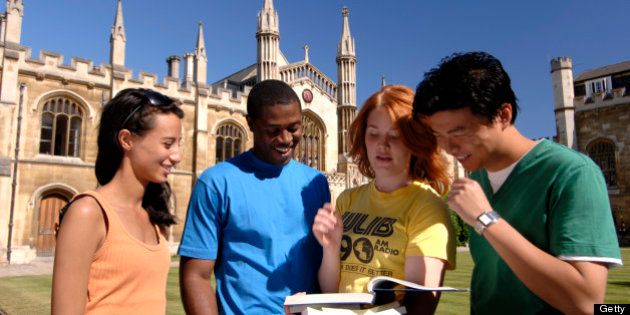 Students in the grounds of the Corpus Christi College, founded by Cambridge residents in 1352, Cambridge, Cambridgeshire, England.