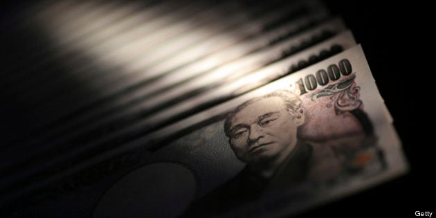 Japanese 10,000 yen banknotes are arranged for a photograph in Tokyo, Japan, on Monday, Feb. 25, 2013. The yen's protracted climb against the dollar over the past four decades is over, said Makoto Utsumi, a former top Japanese currency official. Photographer: Yuriko Nakao/Bloomberg via Getty Images