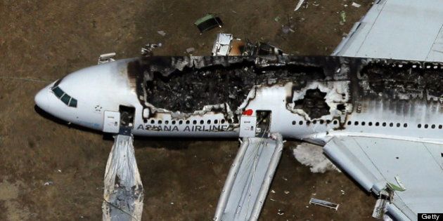 SAN FRANCISCO, CA - JULY 06: A Boeing 777 airplane lies burned on the runway after it crash landed at San Francisco International Airport July 6, 2013 in San Francisco, California. An Asiana Airlines passenger aircraft coming from Seoul, South Korea crashed while landing. There has been at least two casualties reported. (Photo by Ezra Shaw/Getty Images)