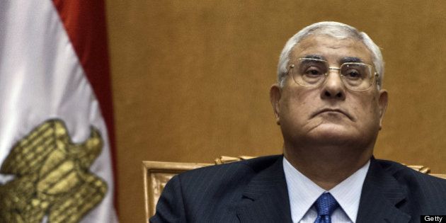 Egypt's chief justice Adly Mansour pauses during his swearing-in ceremony as Egypt's interim president in the Supreme Constitutional Court in Cairo on July 4, 2013, a day after the military ousted and detained president Mohamed Morsi following days of massive protests. The ceremony, which was broadcast live on national television, came after the military swept aside Morsi, a little more than a year after the Islamist leader took office. AFP PHOTO / KHALED DESOUKI (Photo credit should read KHALED DESOUKI/AFP/Getty Images)