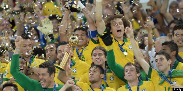 Brazilian players celebrate their victory over Spain 3-0 in the final game of the FIFA Confederations...
