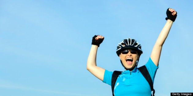 happy excited woman with arms raised.