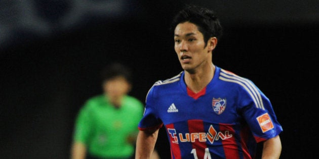 TOKYO, JAPAN - MAY 17: (EDITORIAL USE ONLY) Yoshinori Muto #14 of FC Tokyo in action during the J.League match between F.C. Tokyo and Gamba Osaka at Ajinomoto Stadium on May 17, 2014 in Tokyo, Japan. (Photo by Masashi Hara/Getty Images)