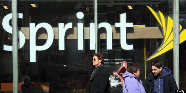 CHICAGO - FEBRUARY 28: The Sprint Nextel logo hangs in the window of a Sprint retail store February 28, 2008 in Chicago Illinois. Sprint said it lost $29.5 billion during the quarter ending Dec. 31. (Photo by Scott Olson/Getty Images)