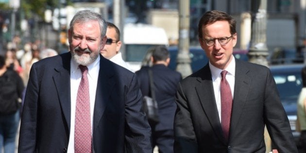 Attornies Carmine Boccuzzi (R) and Jonathan Blackman arrive at the US Federal Courthouse July 22, 2014 in New York. US judge Thomas Griesa on Tuesday ordered Argentina and New York-based hedge funds to urgently reach a deal to avoid Buenos Aires defaulting over more than $1.3 billion in unpaid debts. Presiding over a hearing in his Manhattan courtroom, Griesa refused to grant a request from lawyers for the South American country asking that a US Supreme Court ruling be suspended. The lawyer appointed by Griesa to mediate an agreement between the two sides, Daniel Pollack, has scheduled another meeting on Wednesday to find a solution before Argentina could be forced to default on July 31.AFP PHOTO/Don Emmert (Photo credit should read DON EMMERT/AFP/Getty Images)