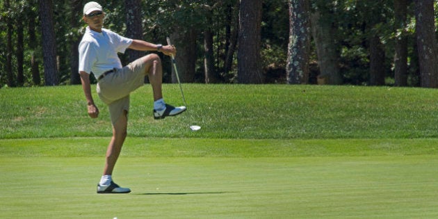 US President Barack Obama reacts to a missed putt on the first green at Farm Neck Golf Club in Oak Bluffs, Massachusetts, August 11, 2013 during the Obama family vacation to Martha's Vineyard. AFP PHOTO/Jim WATSON (Photo credit should read JIM WATSON/AFP/Getty Images)