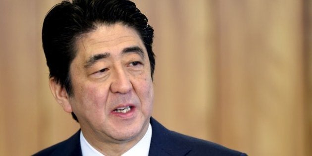 Japan's Prime Minister Shinzo Abe speaks during a ceremony of signature of agreements at Planalto Palace in Brasilia, Brazil on August 01, 2014. Abe is on a three-day official visit to Brazil. AFP PHOTO/EVARISTO SA (Photo credit should read EVARISTO SA/AFP/Getty Images)