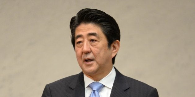 Japanese Prime Minister Shinzo Abe delivers a speech during the Japan Business Federation general assembly in Tokyo on June 3, 2014. The newly appointed head of Japan's top business lobby said June 3 he wants to play a greater role in helping the country improve its badly frayed relations with China. AFP PHOTO / KAZUHIRO NOGI (Photo credit should read KAZUHIRO NOGI/AFP/Getty Images)