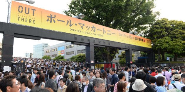 TOKYO, JAPAN - MAY 17: Fans react after the cancellation of the Paul McCartney show due to be held at the National Stadium on May 17, 2014 in Tokyo, Japan. (Photo by Atsushi Tomura/Getty Images)
