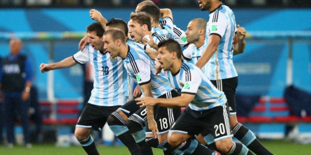 SAO PAULO, BRAZIL - JULY 09: Lionel Messi, Pablo Zabaleta, Martin Demichelis, Marcos Rojo, Lucas Biglia, Javier Mascherano, Rodrigo Palacio, Ezequiel Garay and Sergio Aguero of Argentina celebrate defeating the Netherlands in a penalty shootout during the 2014 FIFA World Cup Brazil Semi Final match between the Netherlands and Argentina at Arena de Sao Paulo on July 9, 2014 in Sao Paulo, Brazil. (Photo by Jamie Squire/Getty Images)