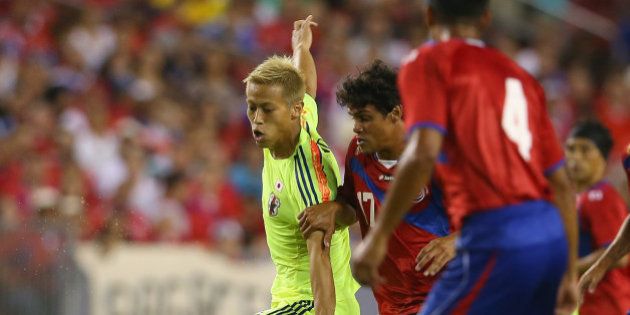TAMPA, FL - JUNE 02: Keisuke Honda of Japan runs the ball during the International Friendly Match between Japan and Costa Rica at Raymond James Stadium on June 2, 2014 in Tampa, Florida. (Photo by Mark Kolbe/Getty Images)