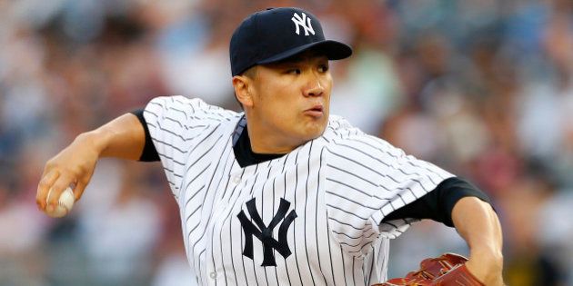 NEW YORK, NY - JUNE 28: Masahiro Tanaka #19 of the New York Yankees delivers a pitch against the Boston Red Sox during the first inning in a MLB baseball game at Yankee Stadium on June 28, 2014 in the Bronx borough of New York City. (Photo by Rich Schultz/Getty Images)