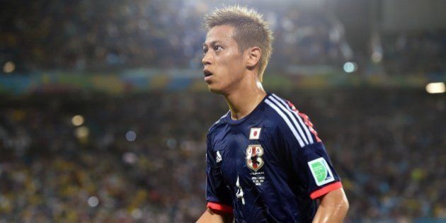 Japan's forward Keisuke Honda is pictured during a Group C match between Japan and Greece at the Dunas Arena in Natal during the 2014 FIFA World Cup on June 19, 2014. AFP PHOTO / ARIS MESSINIS (Photo credit should read ARIS MESSINIS/AFP/Getty Images)