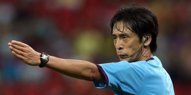 RECIFE, BRAZIL - JUNE 16: Referee Yuichi Nishimura gestures during the FIFA Confederations Cup Brazil 2013 Group B match between Spain and Uruguay at the Arena Pernambuco on June 16, 2013 in Recife, Brazil. (Photo by Miguel Tovar/Getty Images)