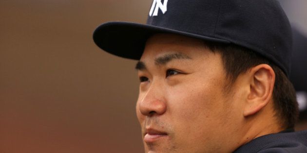 KANSAS CITY, MO - JUNE 6: Masahiro Tanaka #19 of the New York Yankees watches from the dugout during a game against the Kansas City Royals in the first inning at Kauffman Stadium on June 6, 2014 in Kansas City, Missouri. (Photo by Ed Zurga/Getty Images)