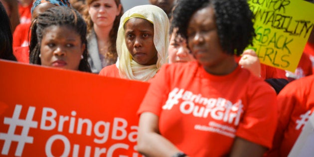 WASHINGTON, DC - MAY 6: Demonstrators, including Tiffani Brown, C, of Greenbelt, MD, gather in front of DC's Nigerian Embassy on Tuesday, May 6, 2014, in Washington, DC. The demonstrators are pushing the Nigerian government to find and free 276 girls who were kidnapped on April 14 from their dormitories at the Government Girls Secondary School in Chibok, Nigeria. All reports allege that the kidnappings are the handiwork of Boko Haram, who oppose the education of girls. There have been protests at embassies around the world, fueled by social media outrage. (Photo by Jahi Chikwendiu/The Washington Post via Getty Images)