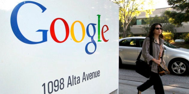 A pedestrian walks past Google Inc. signage displayed at company headquarters in Mountain View, California, U.S., on Thursday, Oct. 13, 2011. Google Inc. is expected to announce quarterly eanrings today after U.S. financial markets close. Photographer: Tony Avelar/Bloomberg via Getty Images