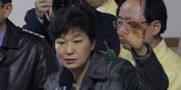 JINDO-GUN, SOUTH KOREA - APRIL 17: South Korean President Park Geun-Hye talks with relatives of missing passengers of a sunken ferry at Jindo gymnasium on April 17, 2014 in Jindo-gun, South Korea. Six are dead, and 290 are missing as reported. The ferry identified as the Sewol was carrying about 470 passengers, including the students and teachers, traveling to Jeju Island. (Photo by Chung Sung-Jun/Getty Images)