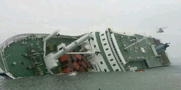 JINDO-GUN, SOUTH KOREA - APRIL 16: In this handout image provided by the Republic of Korea Coast Guard, a passenger ferry sinks off the coast of Jindo Island on April 16, 2014 in Jindo-gun, South Korea. The ferry identified as the Sewol was carrying about 470 passengers, including students and teachers, traveling to Jeju island. (Photo by The Republic of Korea Coast Guard via Getty Images)