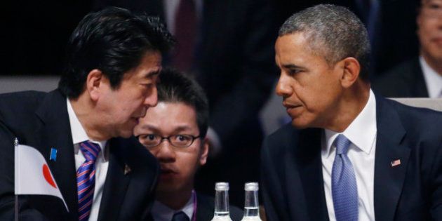 THE HAGUE, NETHERLANDS - MARCH 24: Japan's Prime Minister Shinzo Abe and U.S. President Barack Obama (R) attend the opening session of the at the 2014 Nuclear Security Summit on March 24, 2014 in The Hague, Netherlands. The Nuclear Security Summit, held March 24-25, will be attended by world leaders and is aimed at preventing nuclear terrorism. (Photo by Yves Herman - Pool/Getty Images)