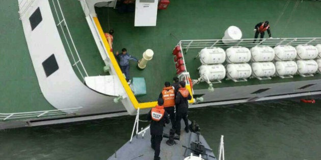 JINDO-GUN, SOUTH KOREA - APRIL 16: In this handout image provided by the Republic of Korea Coast Guard, passengers are rescued by the Republic of Korea Coast Guard from a ferry sinking off the coast of Jindo Island on April 16, 2014 in Jindo-gun, South Korea. The ferry identified as the Sewol was carrying about 470 passengers, including students and teachers, traveling to Jeju island. (Photo by The Republic of Korea Coast Guard via Getty Images)