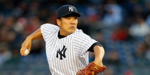 NEW YORK, NY - APRIL 09: Masahiro Tanaka #19 of the New York Yankees delivers a pitch in the first inning against the Baltimore Orioles at Yankee Stadium on April 9, 2014 in the Bronx borough of New York City. (Photo by Mike Stobe/Getty Images)
