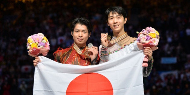 SAITAMA, JAPAN - MARCH 28: (L to R) Tatsuki Machida (Silver) of Japan and Yuzuru Hanyu (Gold) of Japan pose with medal in the victory ceremony during ISU World Figure Skating Championships at Saitama Super Arena on March 28, 2014 in Saitama, Japan. (Photo by Atsushi Tomura/Getty Images)