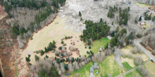 SNOHOMISH COUNTY, WASHINGTON - MARCH 22: In this handout from Washington State Dept of Transportation, an aerial of a mudslide that covered SR 530 March 22, 2014 between Darrington and Arlington, Washington. Eight people have been confirmed dead and at least 18 others are still missing after a massive mudslide leveled homes and blocked a river and a road. (Photo by Washington State Dept of Transportation via Getty Images)