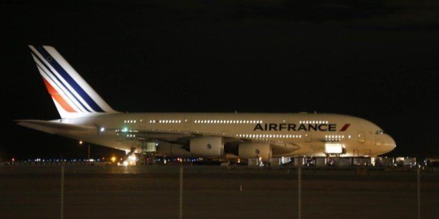 Air France Airbus 380, Flight 65, sits on the runway at the Salt Lake City International Airport being inspected by the FBI on November 17, 2015 in Salt LAke City, Utah. Two Air France flights bound for Paris from the United States were diverted November 17, 2015 and landed safely after the airline received anonymous bomb threats, the carrier said. Flight 65 from Los Angeles and Flight 55 from Washington were 'subject to anonymous threats received after their respective takeoff,' the airline said in a statement. AFP PHOTO / GEORGE FREY (Photo credit should read GEORGE FREY/AFP/Getty Images)