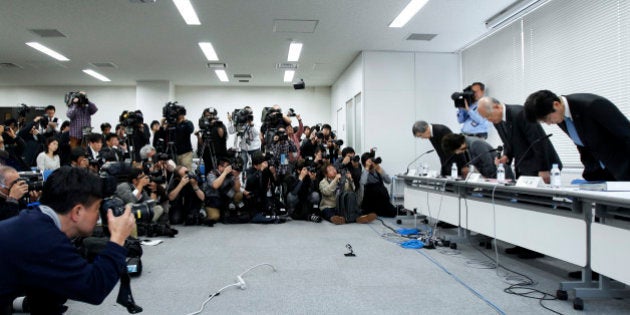 Masatoshi Takeichi, head of Riken Center for Developmental Biology, from left, Maki Kawai, an executive director at Riken, Ryoji Noyori, a Nobel Prize-winning chemist and president of Riken, and Minoru Yonekura, an executive director at Riken, bow during a news conference in Tokyo, Japan, on Friday, March 14, 2014. Japans Riken center apologized for errors in a pair of studies that had outlined a simpler, quicker way of making stem cells and said the institute is considering recommending a retraction. Photographer: Kiyoshi Ota/Bloomberg via Getty Images