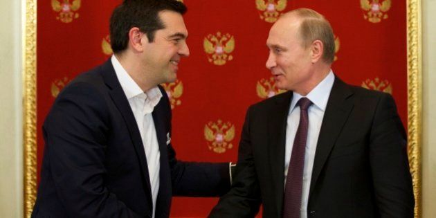 Russian President Vladimir Putin, right, and Greek Prime Minister Alexis Tsipras shake hands during a signing ceremony in the Kremlin in Moscow, Russia, Wednesday, April 8, 2015. Russian President Vladimir Putin said the leader of Greece did not ask for financial aid during an official visit, easing speculation that Athens might use its relations with Moscow to gain advantage in bailout talks with European creditors. (AP Photo/Alexander Zemlianichenko, Pool)
