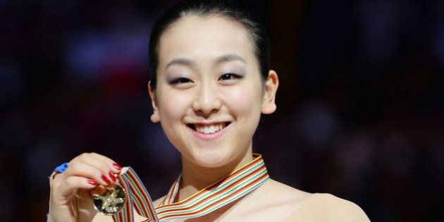SAITAMA, JAPAN - MARCH 29: Mao Asada (Gold) of Japan poses with medal in the victory ceremony during ISU World Figure Skating Championships at Saitama Super Arena on March 29, 2014 in Saitama, Japan. (Photo by Atsushi Tomura/Getty Images)