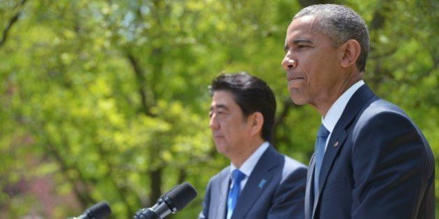 US President Barack Obama (R) pauses as he speaks during a joint press conference in the Rose Garden with Japan's Prime Minister Shinzo Abe on April 28, 2015 in Washington, DC. AFP PHOTO/MANDEL NGAN (Photo credit should read MANDEL NGAN/AFP/Getty Images)