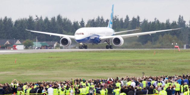 EVERETT, WA - SEPTEMBER 17: A Boeing 787-9 Dreamliner taxis on the runway in front of a crowd of employees before its first flight September 17, 2013 at Paine Field in Everett, Washington. The 787-9 is twenty feet longer than the original 787-8 and can carry more passengers and more fuel. (Stephen Brashear/Getty Images)